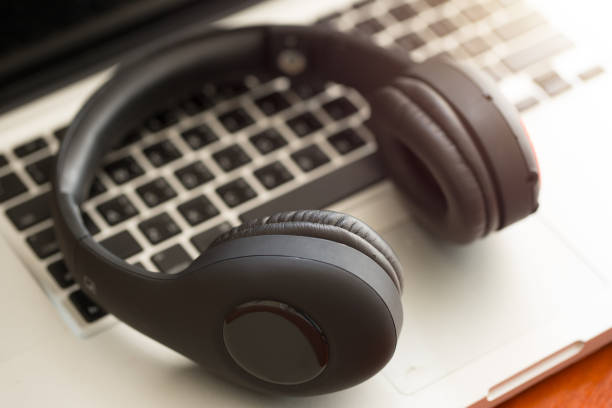 istock earphones and laptop. 842156358