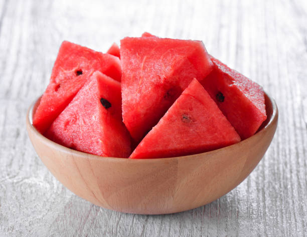 istock water melon in wood bowl on table 842156976