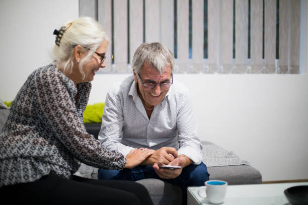 istock Senior couple at home using smartphone 842162942
