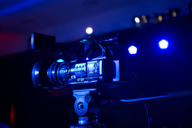 istock Closeup of television camera in studio under blue light. 842163656