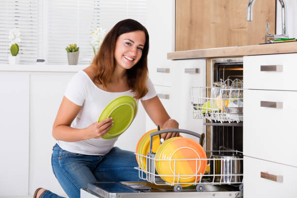 istock Woman Arranging Plates In Dishwasher 842166784