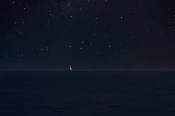 Photo of Sailboat in night immensity