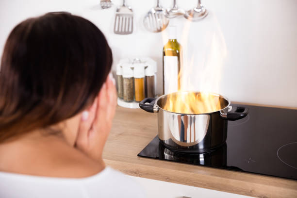 istock Woman Holding Cooking Pot With Fire 842174764