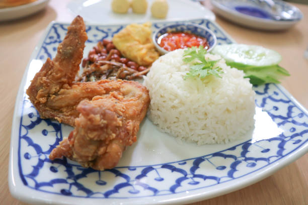 nasi lemak or rice with fried fish ,omelet and fried chicken