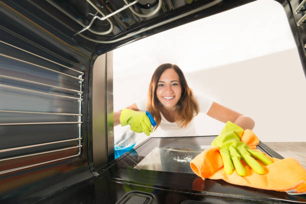 istock Woman Cleaning Inside The Oven 842180222