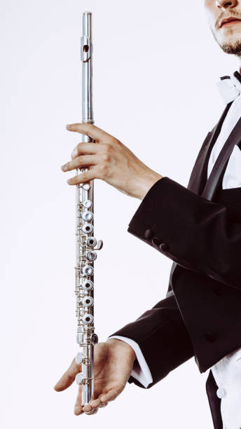 istock Male flutist wearing tailcoat holds flute 842180292