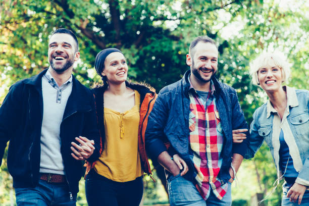 istock Friends hanging out in park 842180338