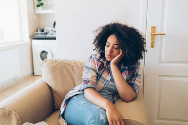 istock African woman sleeping at home 842180612
