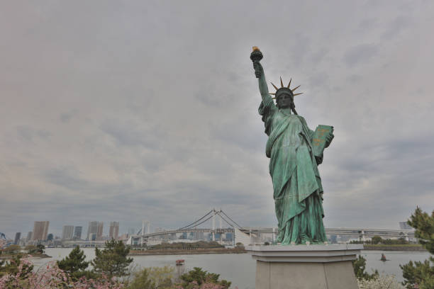 istock statue of liberty with Rainbow Bridge 842181214