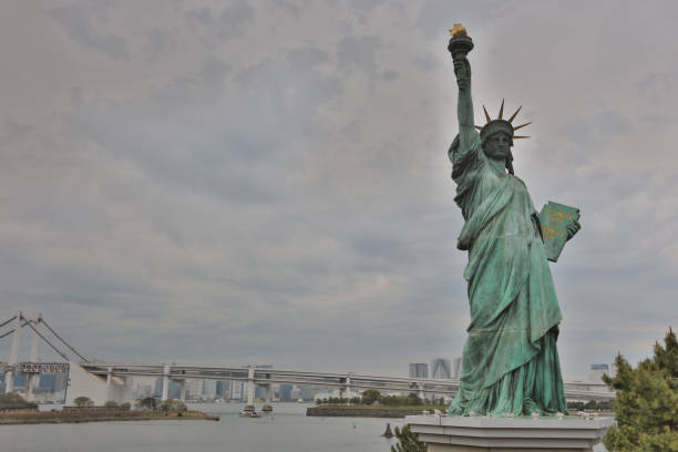 istock statue of liberty with Rainbow Bridge 842181256