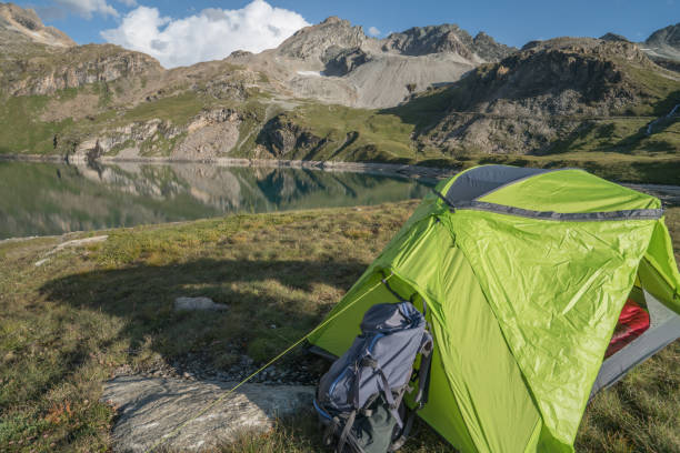 istock Campsite settled by a mountain lake 842187448