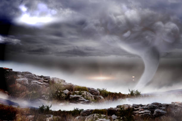 istock Stormy sky with tornado over landscape 842187564