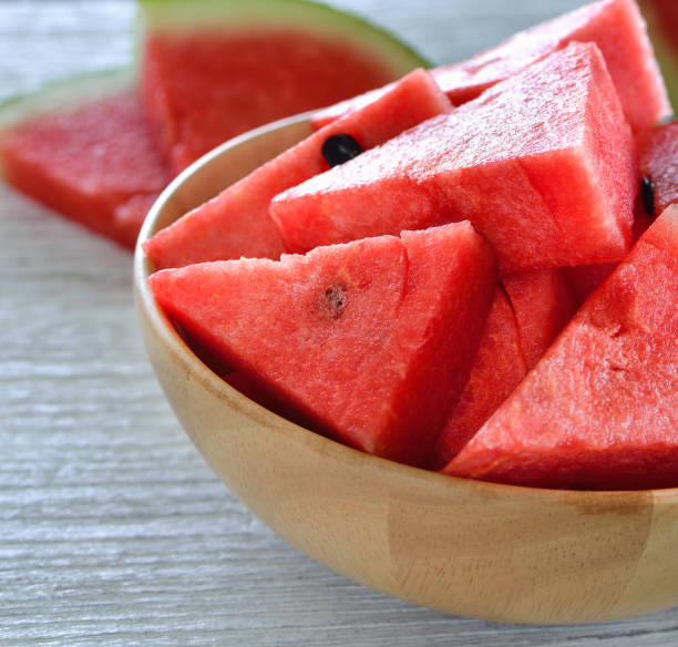 istock water melon in wood bowl on table 842190580
