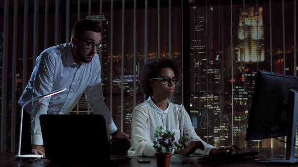 istock Man and woman at computer in office 842190670
