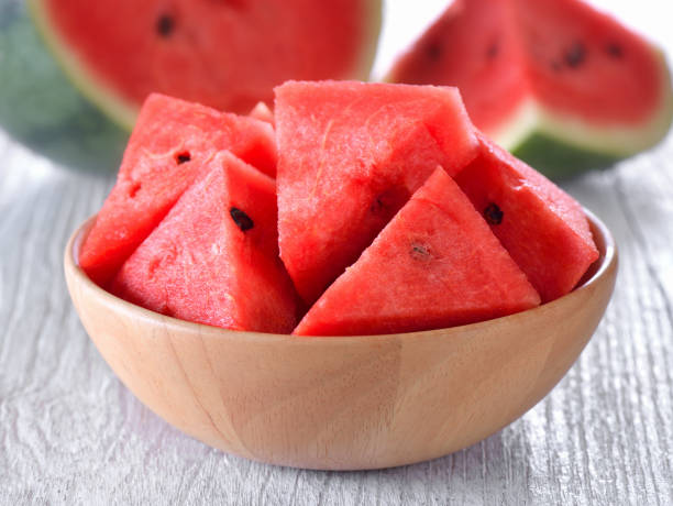 water melon in wood bowl on table