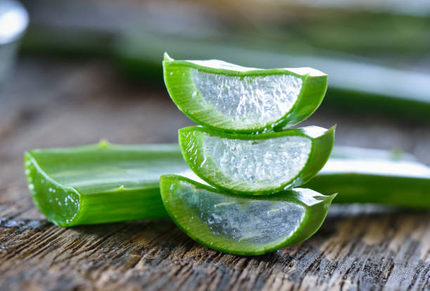 istock Aloe Vera leaves on wooden background 842190784