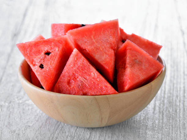 istock water melon in wood bowl on table 842190792
