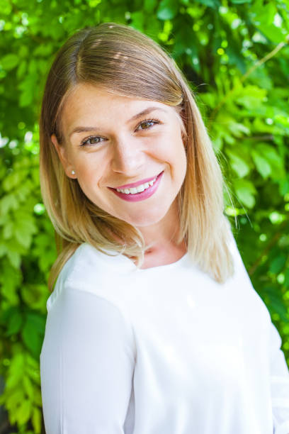 istock Beautiful young woman smiling 842190854