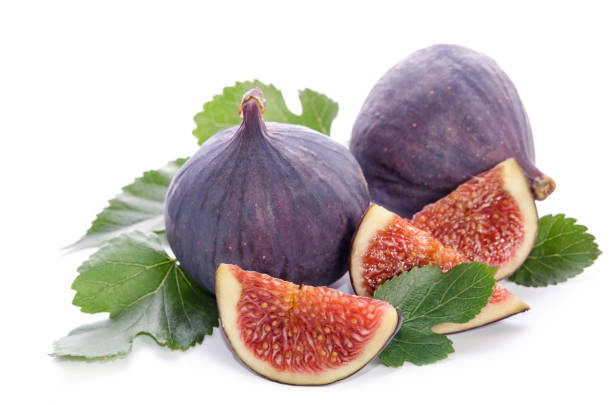 istock fruits of Fig tree (whole and part) with leaves isolated on white 842191000