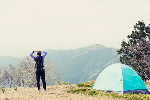 Woman is enjoying Camping in nature