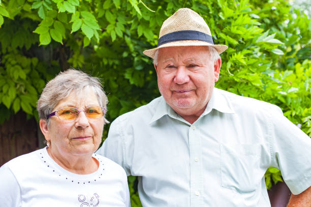 Happy senior couple in love posing in the park outdoor