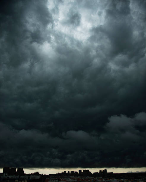 istock Dark stormy clouds over city 842195664
