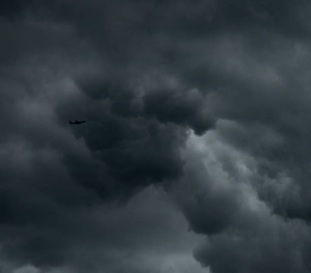 istock Single airplane in a stormy sky 842195846