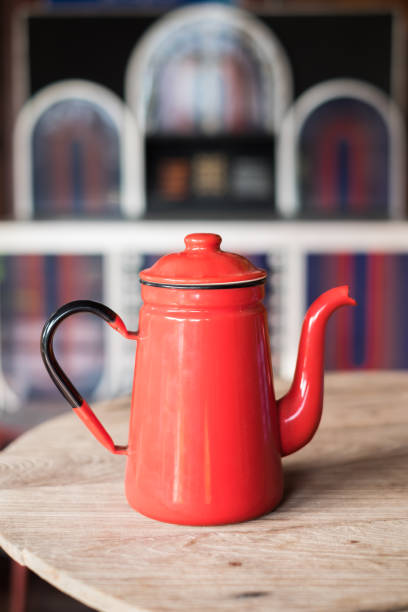 istock Red vintage teapot on wood table 842196612