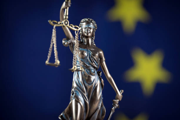 Law and Justice symbols. EU flag background. stock photo