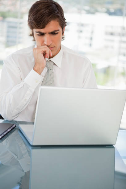 istock Serious businessman on his laptop 842203362