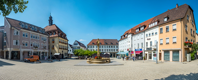 Neckarsulm: people visit old market place in Neckarsulm with fountain.