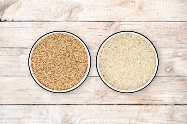 istock Brown and white Basmati Rice bowls on wood background 842209806