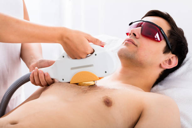 istock Therapist Giving Laser Epilation Treatment To Man 842209840