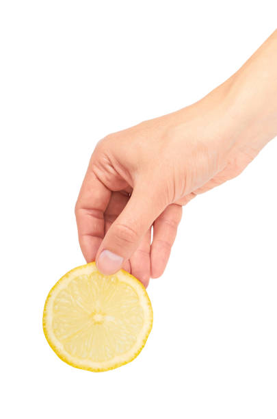 istock Vitamin yellow lemon in hand. Isolated on white background 842210404