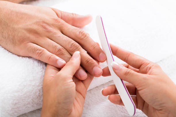 istock Manicurist Filing Person's Nails 842210986