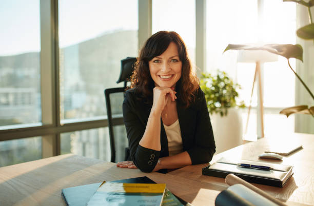 istock Beautiful female executive in modern office 842216578