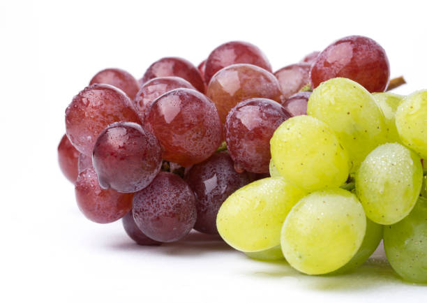 istock A bunch of green and red grapes isolated on a white. 842216852