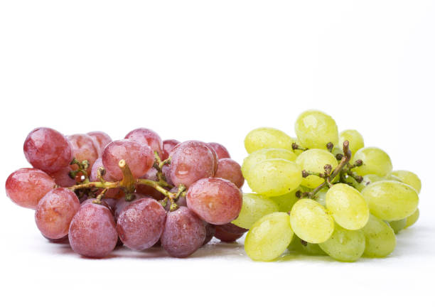 istock A bunch of green and red grapes isolated on a white. 842217606
