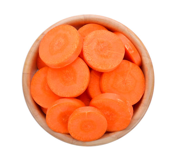 istock carrot slices in wood bowl 842219884
