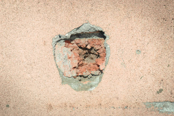 istock Concrete wall with a trace of a bullet shot 842227358