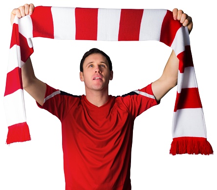 Football fan in red holding scarf on white background
