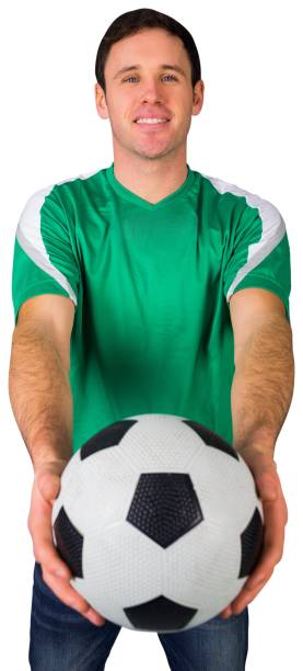 istock Handsome football fan in green 842228296