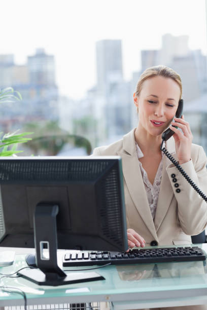 istock Woman on the phone in her office 842231640