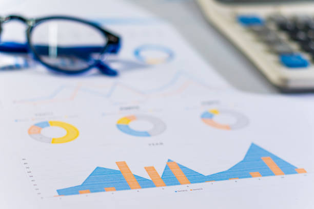 istock Close up business concept, Calculator and glasses on summary report on table office 842231908