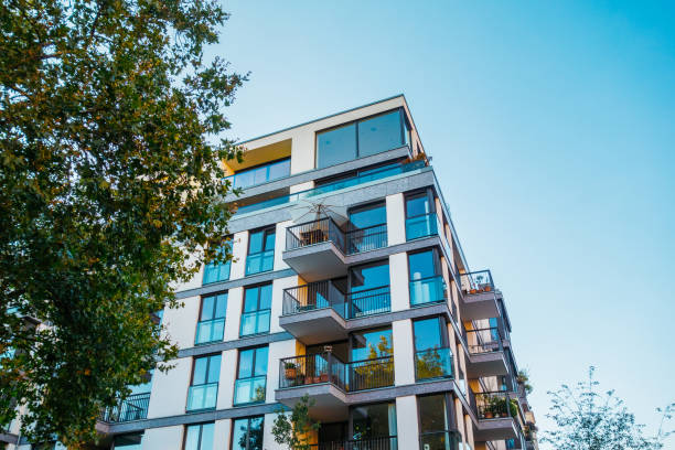 istock very modern apartment house with green tree 842232504