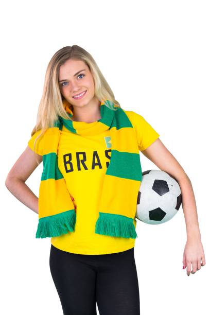 istock Pretty football fan in brasil tshirt 842235708
