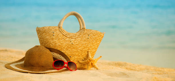 istock Summer beach with accessories. Blur azure sea on background 842238414