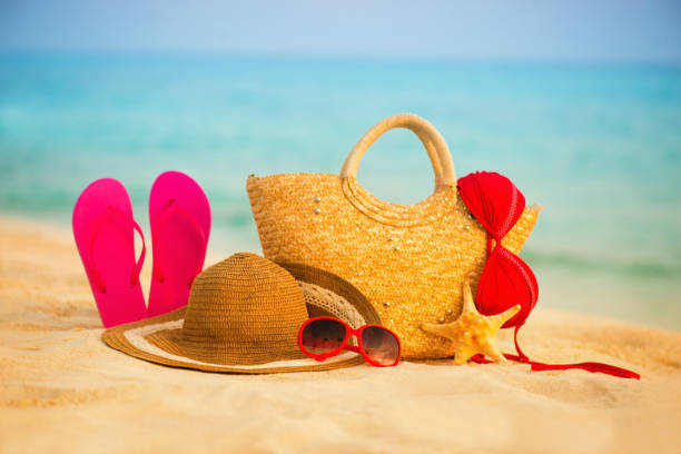 istock Summer beach with accessories. Blur azure sea on background 842238470