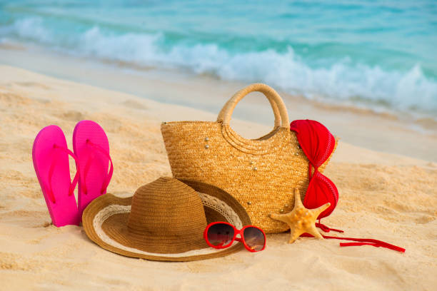 istock Summer beach with accessories. Blur azure sea on background 842238546