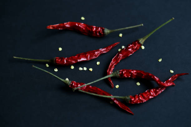 istock Top view of dried red pepper on black background. 842241202